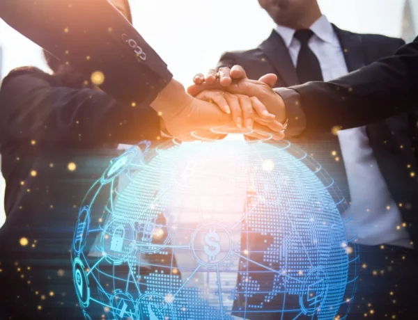 Global mobility services image showing business professionals collaborating with a digital globe representing international workforce solutions and global talent mobility