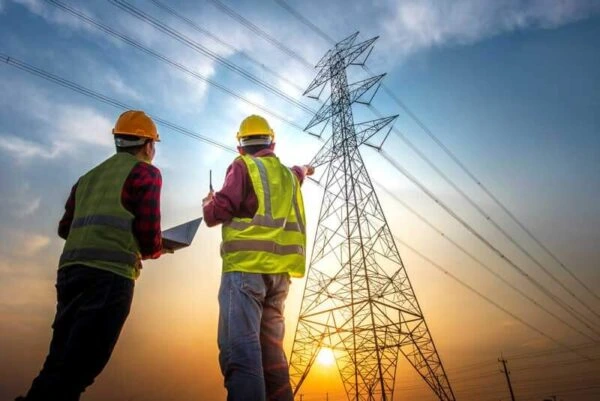 Power distribution engineers inspecting electricity transmission lines for Al Saqib Recruitment Agency