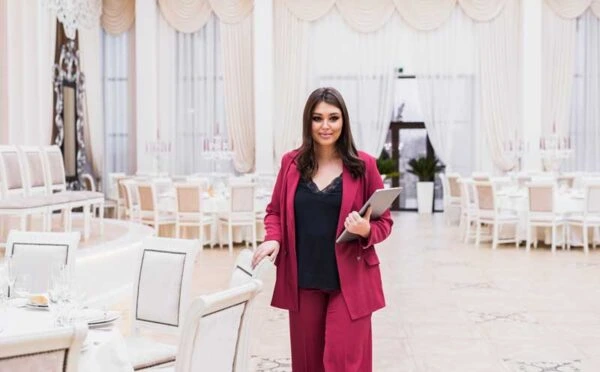 Professional event planner managing a banquet venue for Al Saqib Recruitment Agency